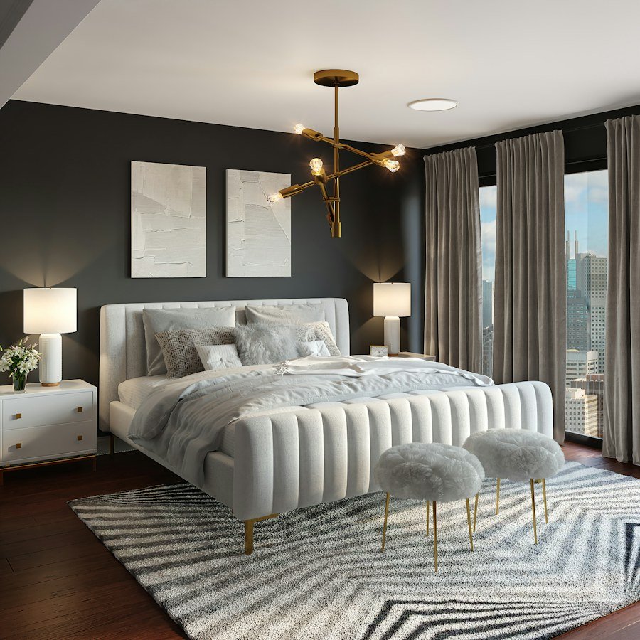 Tailored bedroom with a soft upholstered bed and charcoal accent wall